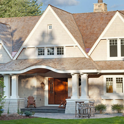 Elegant beige two-story gable roof photo in Minneapolis