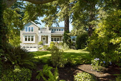 Example of a mid-sized classic two-story wood exterior home design in Vancouver