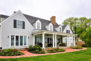 Inspiration for a mid-sized timeless gray two-story wood exterior home remodel in Baltimore with a shingle roof