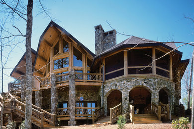 Huge mountain style multicolored three-story mixed siding exterior home photo in Other with a shingle roof