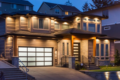 Inspiration for a mid-sized contemporary beige two-story mixed siding exterior home remodel in Portland