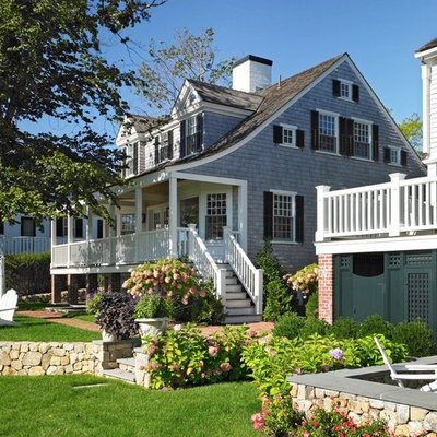 Inspiration for a mid-sized coastal two-story wood gable roof remodel in Boston