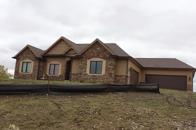 Inspiration for a mid-sized timeless brown one-story concrete fiberboard exterior home remodel in Other