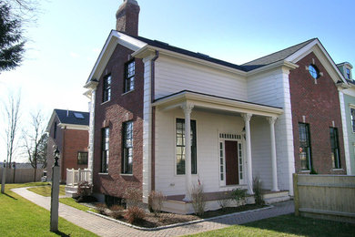 Example of a country exterior home design in Boston