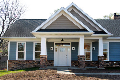 Inspiration for a mid-sized craftsman blue one-story mixed siding exterior home remodel in Richmond with a shingle roof