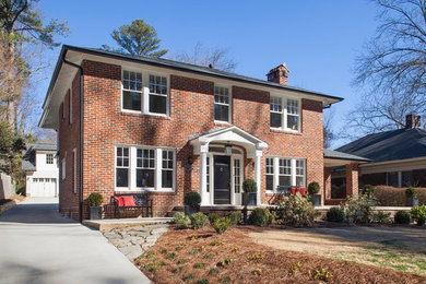 Mid-sized elegant red two-story brick exterior home photo in Atlanta