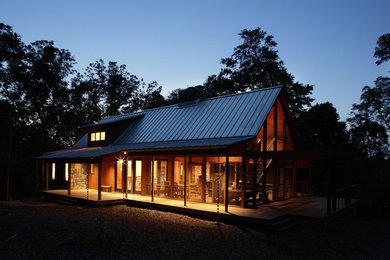 Inspiration for a small rustic brown one-story wood exterior home remodel in Raleigh