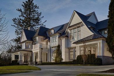 Large elegant white two-story concrete fiberboard exterior home photo in Detroit with a shingle roof