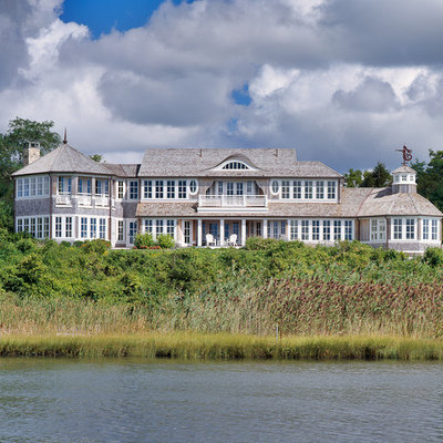 Huge coastal gray two-story wood house exterior idea in Boston with a shingle roof