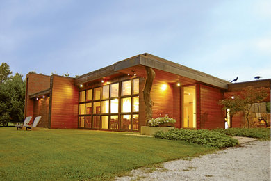 Example of a large minimalist brown one-story wood exterior home design in Chicago