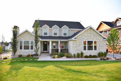 Example of a large transitional beige two-story mixed siding exterior home design in Salt Lake City with a shingle roof