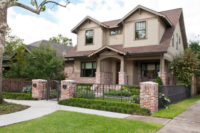Traditional beige two-story gable roof idea in Houston