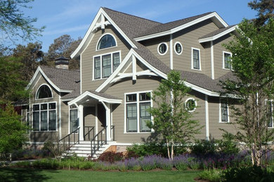 Inspiration for a large asian gray two-story wood gable roof remodel in Other
