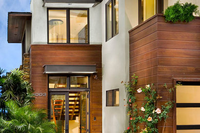 Inspiration for a huge coastal two-story exterior home remodel in Los Angeles