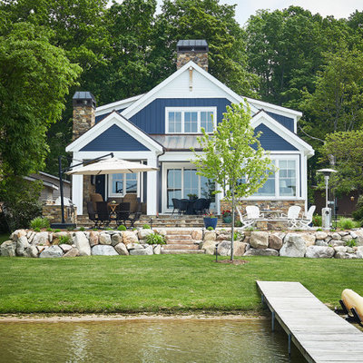Beach style blue two-story exterior home photo in Grand Rapids