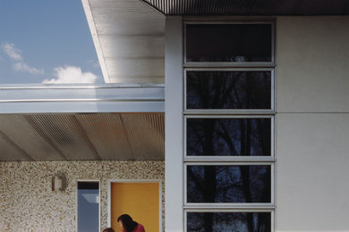 Contemporary two-story concrete exterior home idea in Denver