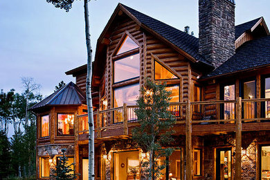 Inspiration for a mid-sized rustic beige two-story mixed siding exterior home remodel in Other with a shingle roof