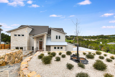 Inspiration for a mid-sized contemporary gray two-story mixed siding house exterior remodel in Austin with a butterfly roof and a shingle roof