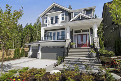 Example of an arts and crafts exterior home design in Vancouver