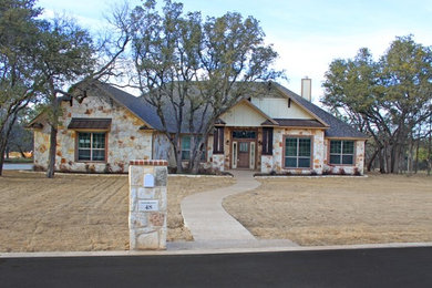 Inspiration for a craftsman beige one-story wood exterior home remodel in Austin