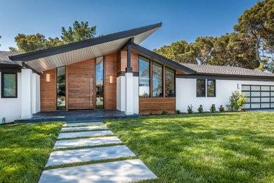 Inspiration for a large and white retro bungalow house exterior in San Francisco with mixed cladding.