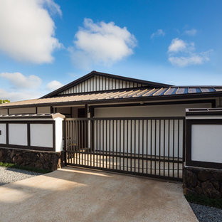 Mid-sized zen white stucco exterior home idea in Hawaii with a hip roof