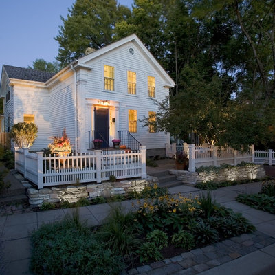 Small traditional white two-story wood exterior home idea in Minneapolis