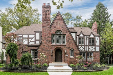 Inspiration for a transitional brick house exterior remodel in Detroit