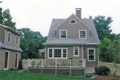 Mid-sized mountain style gray three-story wood exterior home photo in Boston with a gambrel roof