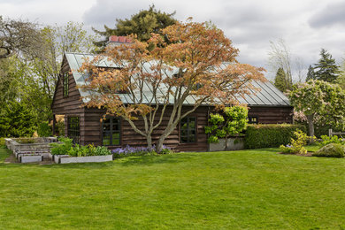 Rustic three-story wood gable roof idea in Seattle