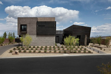 Large contemporary gray two-story stucco exterior home idea in Las Vegas