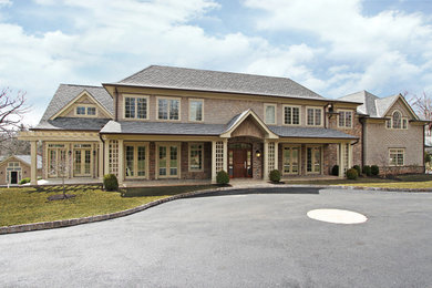 Elegant beige two-story mixed siding exterior home photo in New York