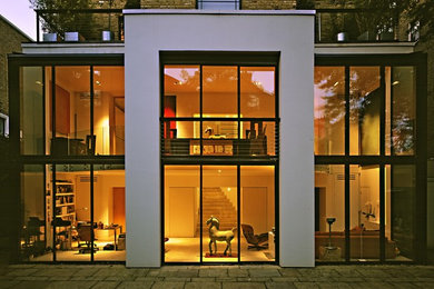 Design ideas for a contemporary two floor glass house exterior in London.