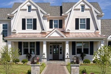 Example of a trendy two-story exterior home design
