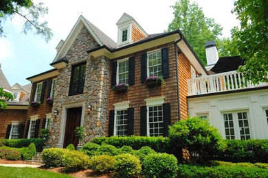 Inspiration for a large timeless brown two-story mixed siding exterior home remodel in Raleigh