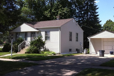 Inspiration for a large white wood exterior home remodel in Chicago