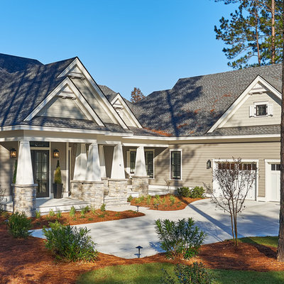 Inspiration for a large transitional gray two-story concrete fiberboard exterior home remodel in Atlanta with a hip roof