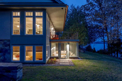 Inspiration for a large timeless gray two-story mixed siding house exterior remodel in Burlington