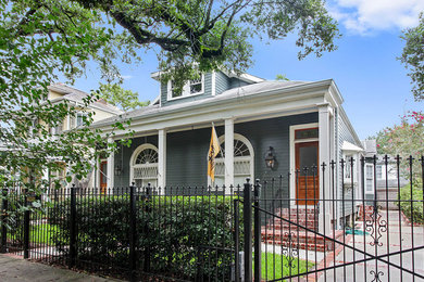 Large craftsman gray two-story wood house exterior idea in New Orleans with a shingle roof