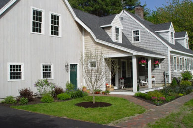 Example of a mid-sized classic gray two-story mixed siding gable roof design in Portland Maine