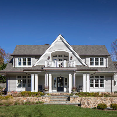 Elegant gray two-story wood exterior home photo in DC Metro with a shingle roof
