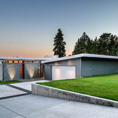 Small trendy gray one-story metal exterior home photo in Seattle with a shed roof