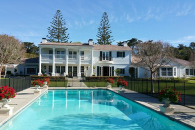 Example of a large classic white two-story vinyl exterior home design in Santa Barbara with a shingle roof