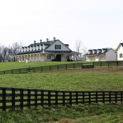 Example of a large cottage two-story wood exterior home design in Nashville