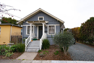 Example of a mid-sized transitional blue two-story wood exterior home design in San Francisco with a shingle roof