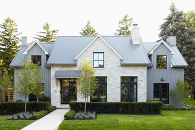Mid-sized contemporary gray two-story mixed siding house exterior idea in Toronto with a metal roof