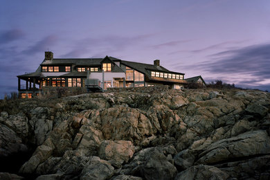 Example of a huge beach style two-story wood exterior home design in Boston