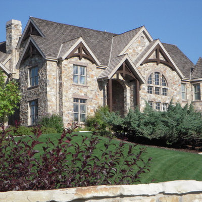 Example of a classic stone exterior home design in Salt Lake City