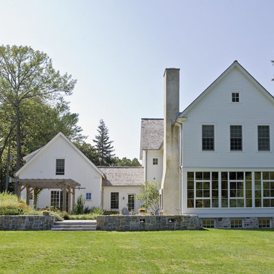 Farmhouse wood exterior home idea in New York