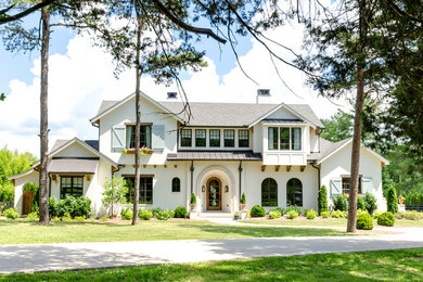 Traditional white two-story exterior home idea in Nashville with a mixed material roof